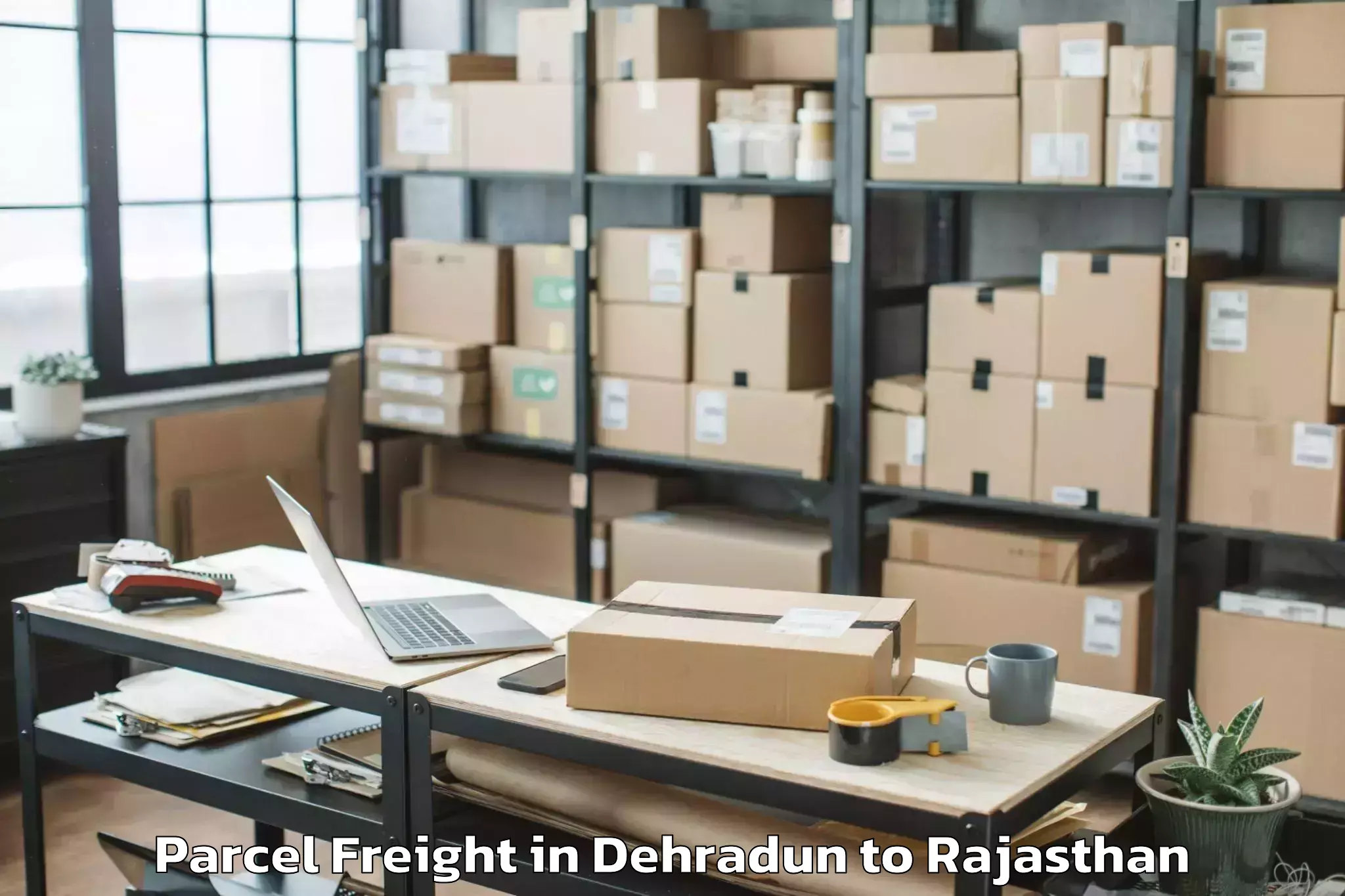 Easy Dehradun to Maulana Azad University Jodhpu Parcel Freight Booking